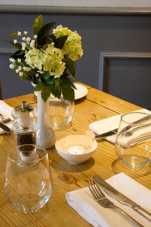 The Oak House Hotel Axbridge Exterior photo A restaurant table set for service
